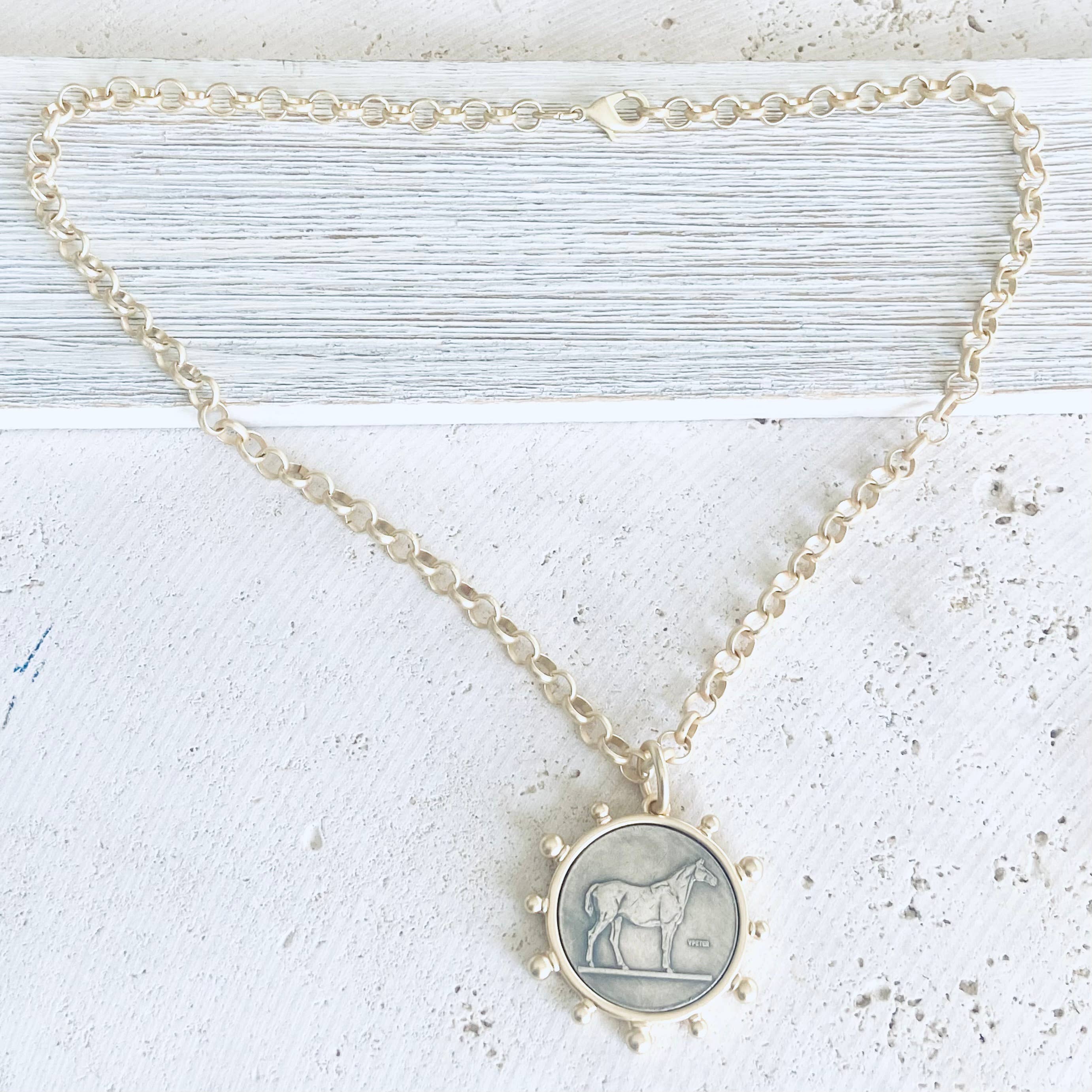 Matte gold horse coin jewelry