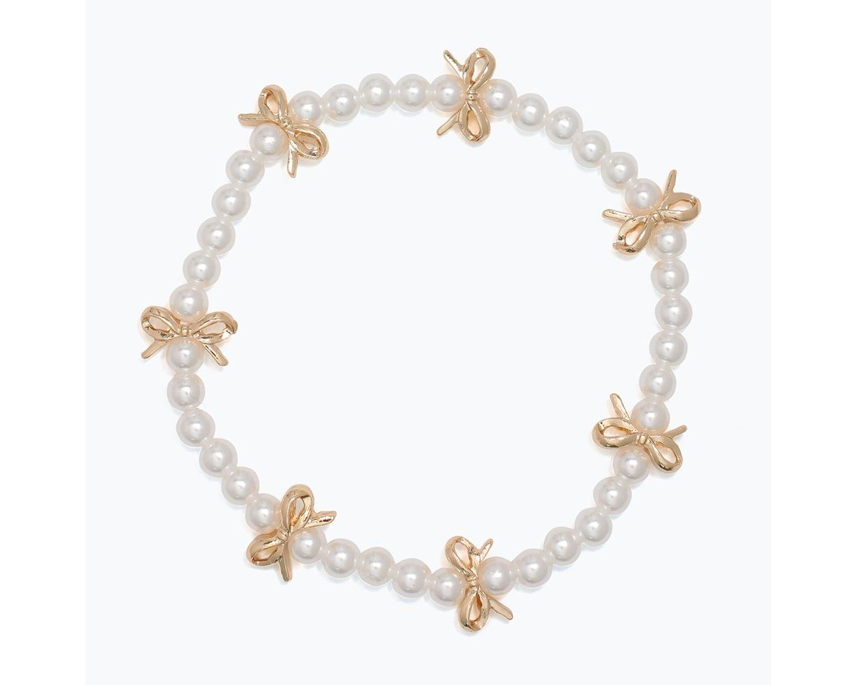 Little Loves white pearls gold bows bracelet